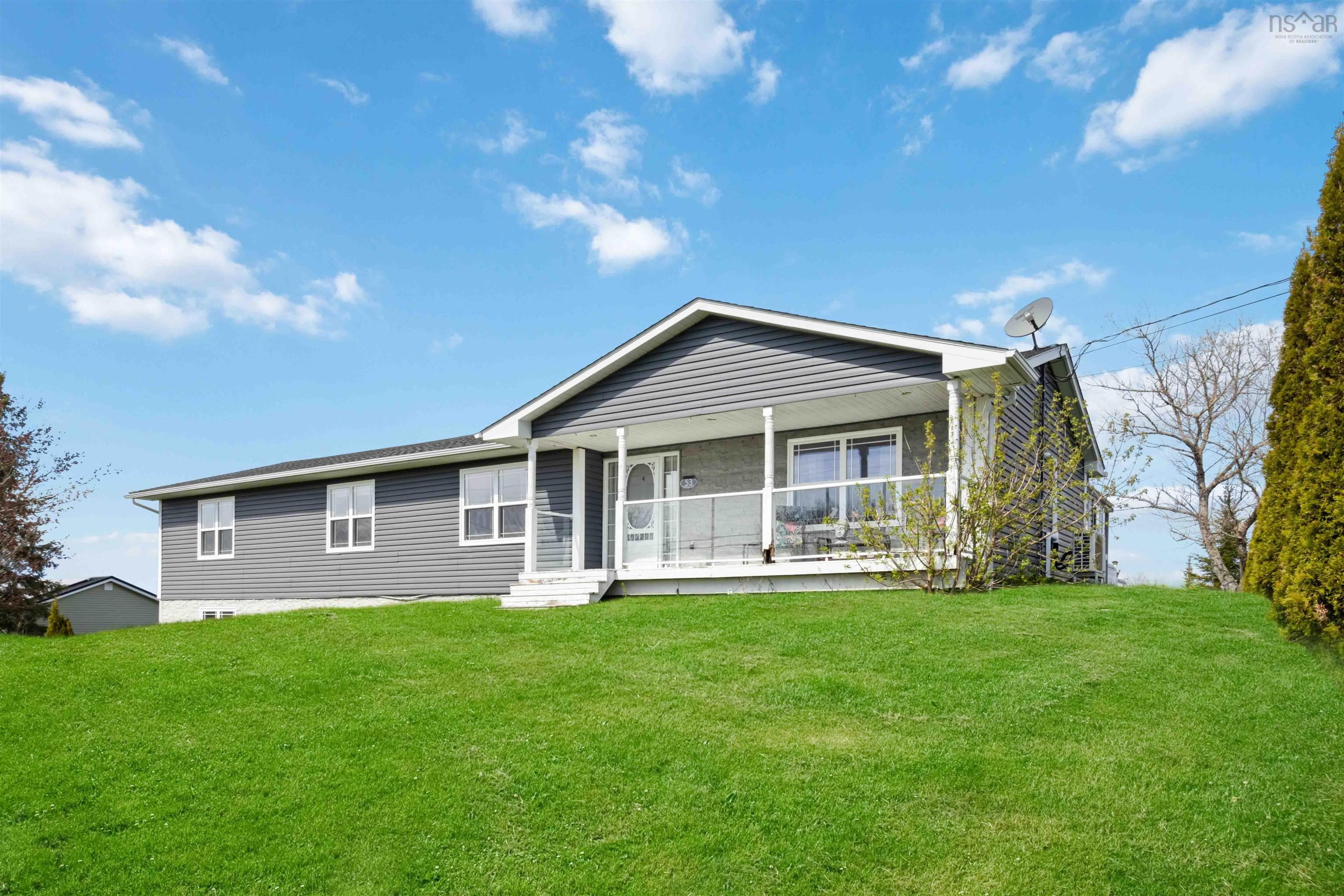 View of front of home with a porch and a front lawn