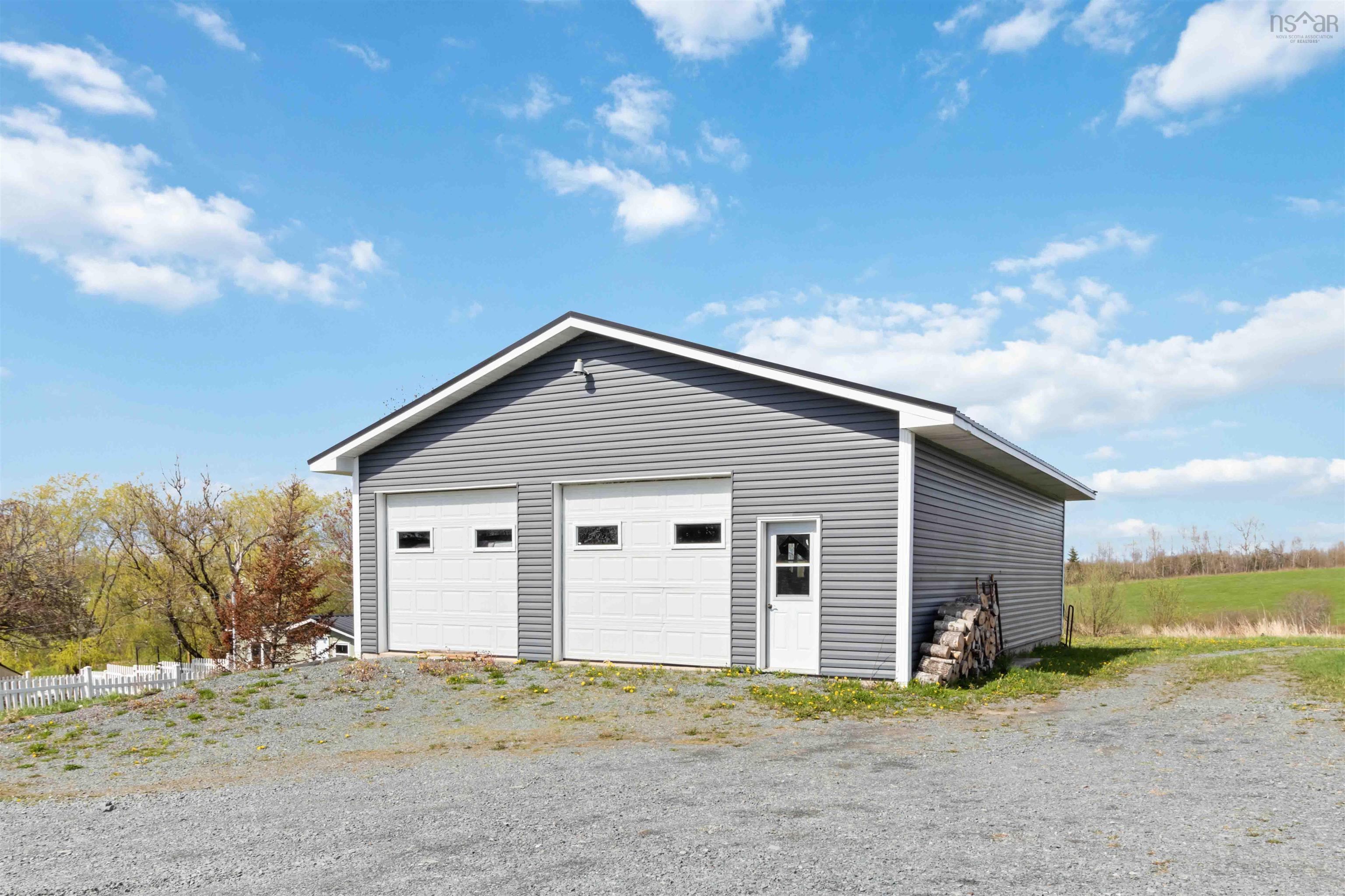 Detached garage featuring fence