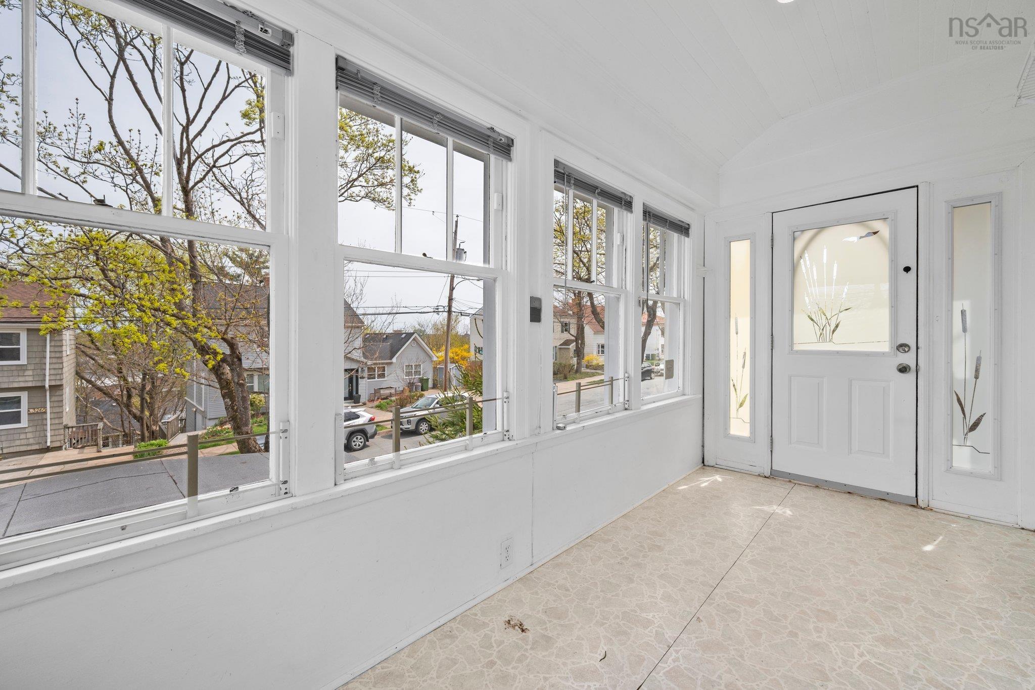 Entrance foyer featuring lofted ceiling