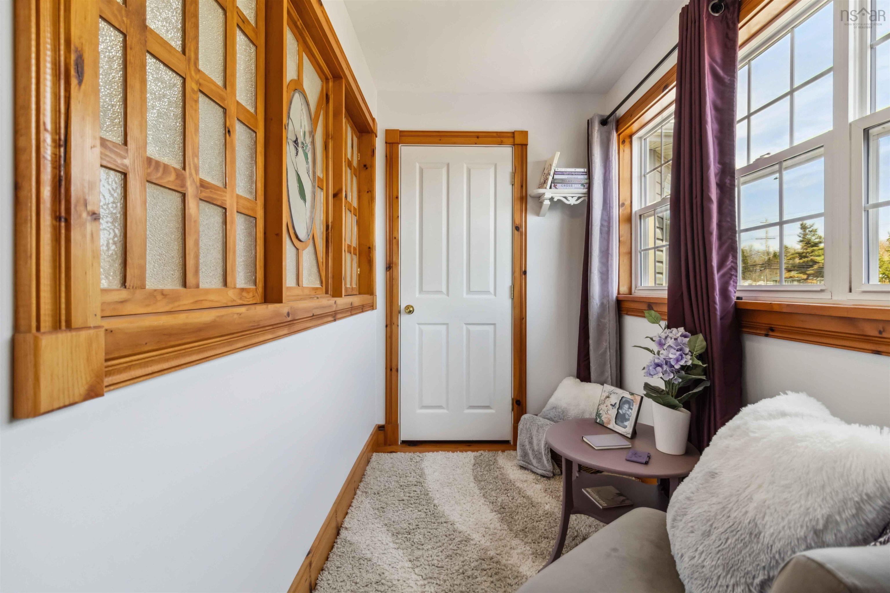 Sitting room featuring wood finished floors