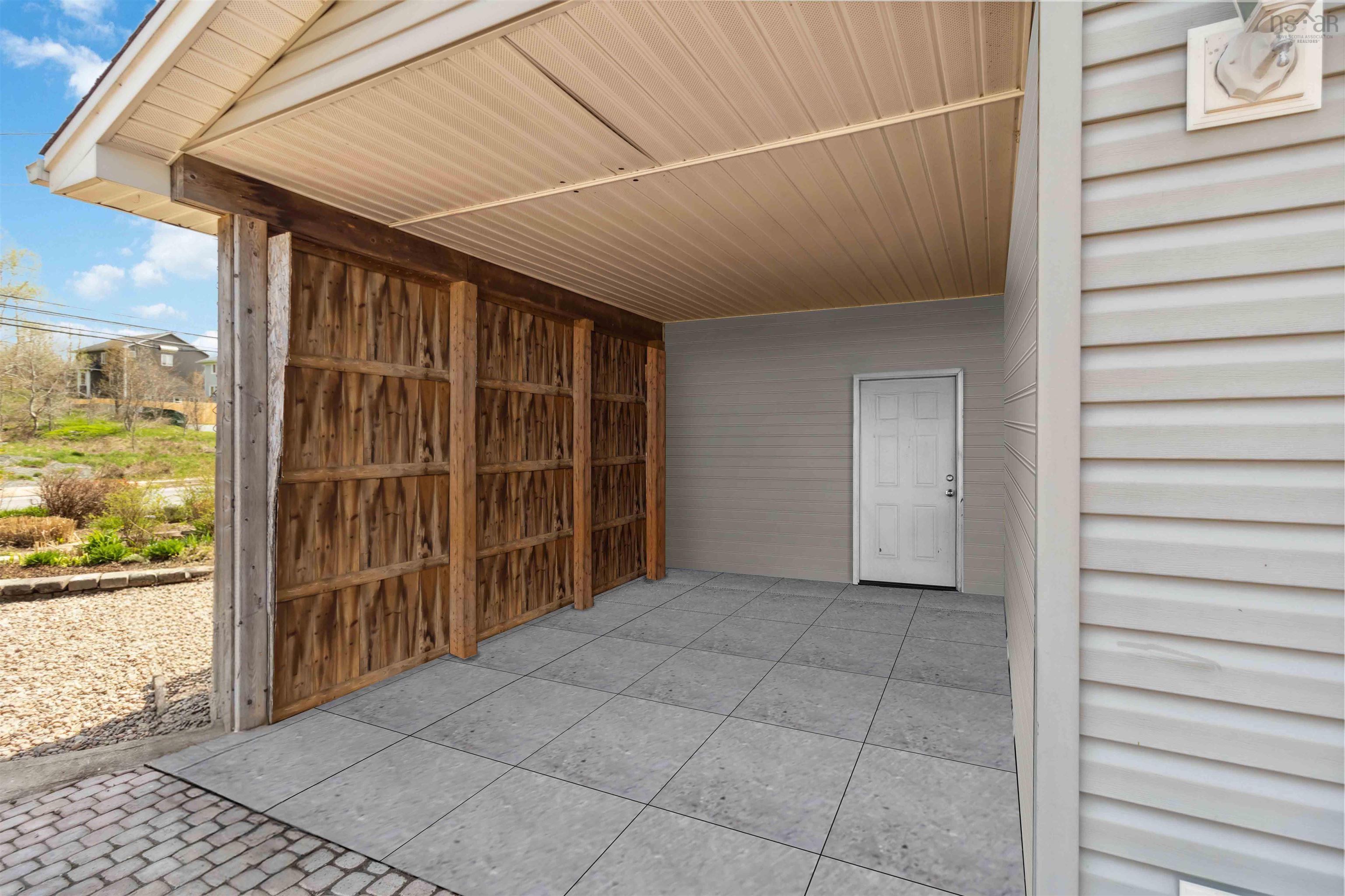 View of patio featuring a carport