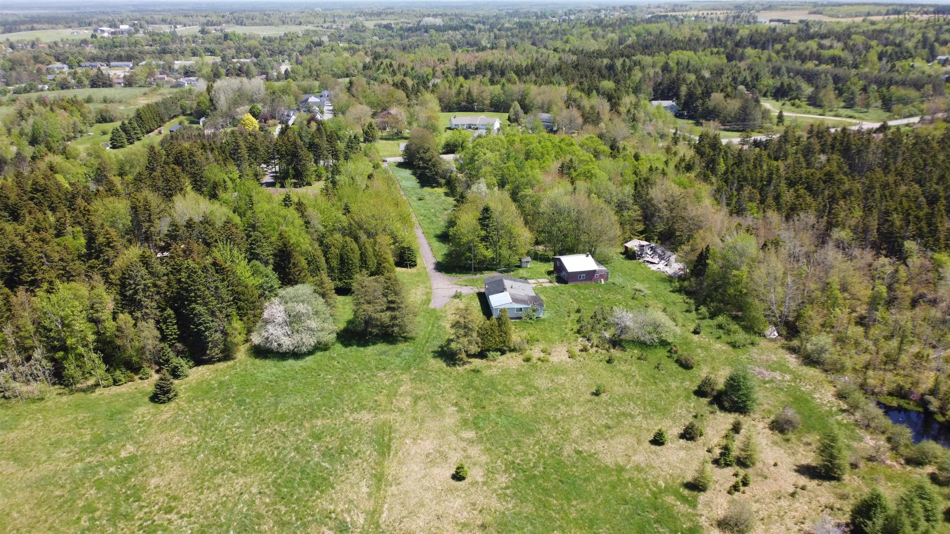 Aerial overview of property's location with a forest
