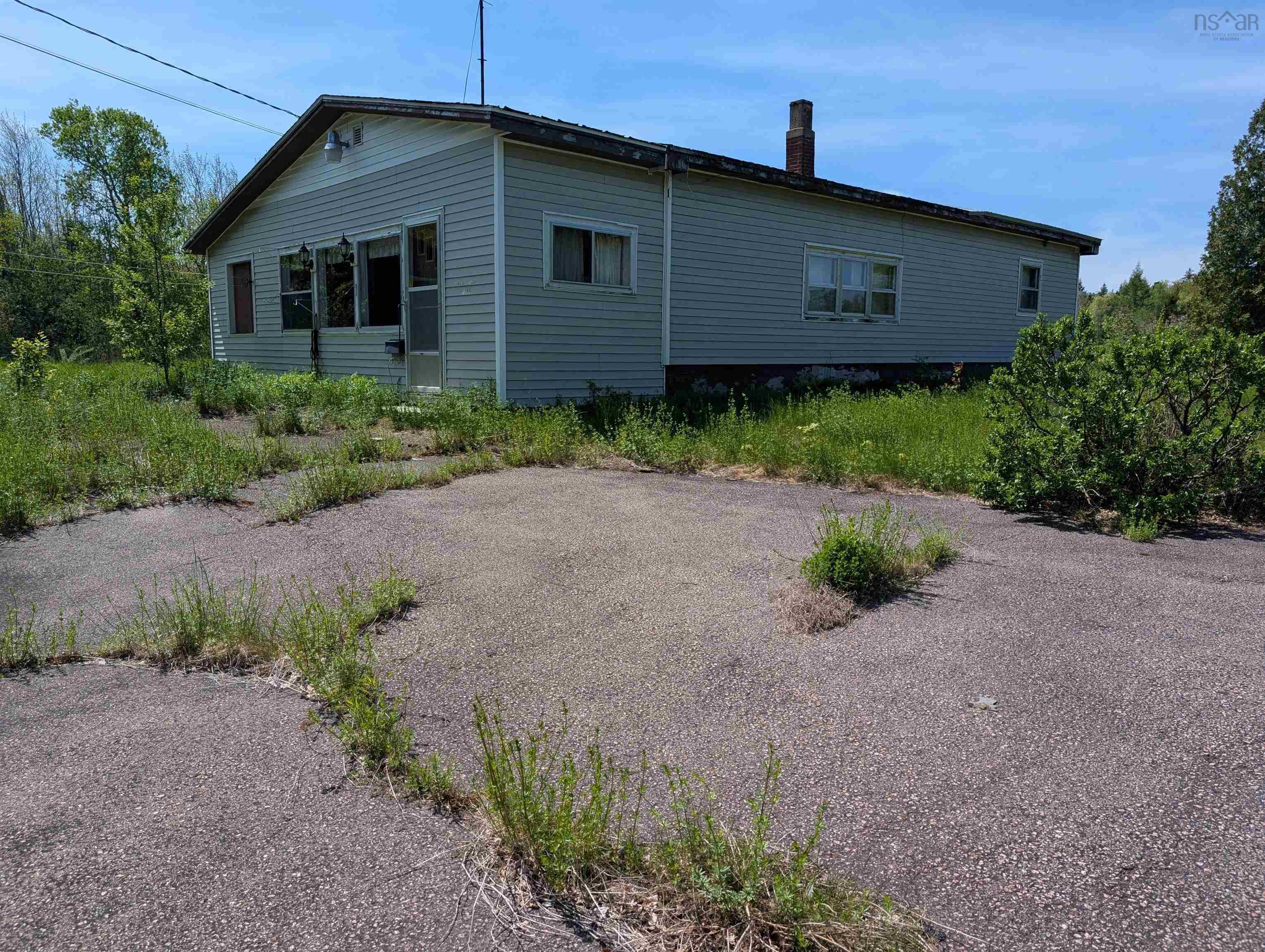 View of side of home with a chimney