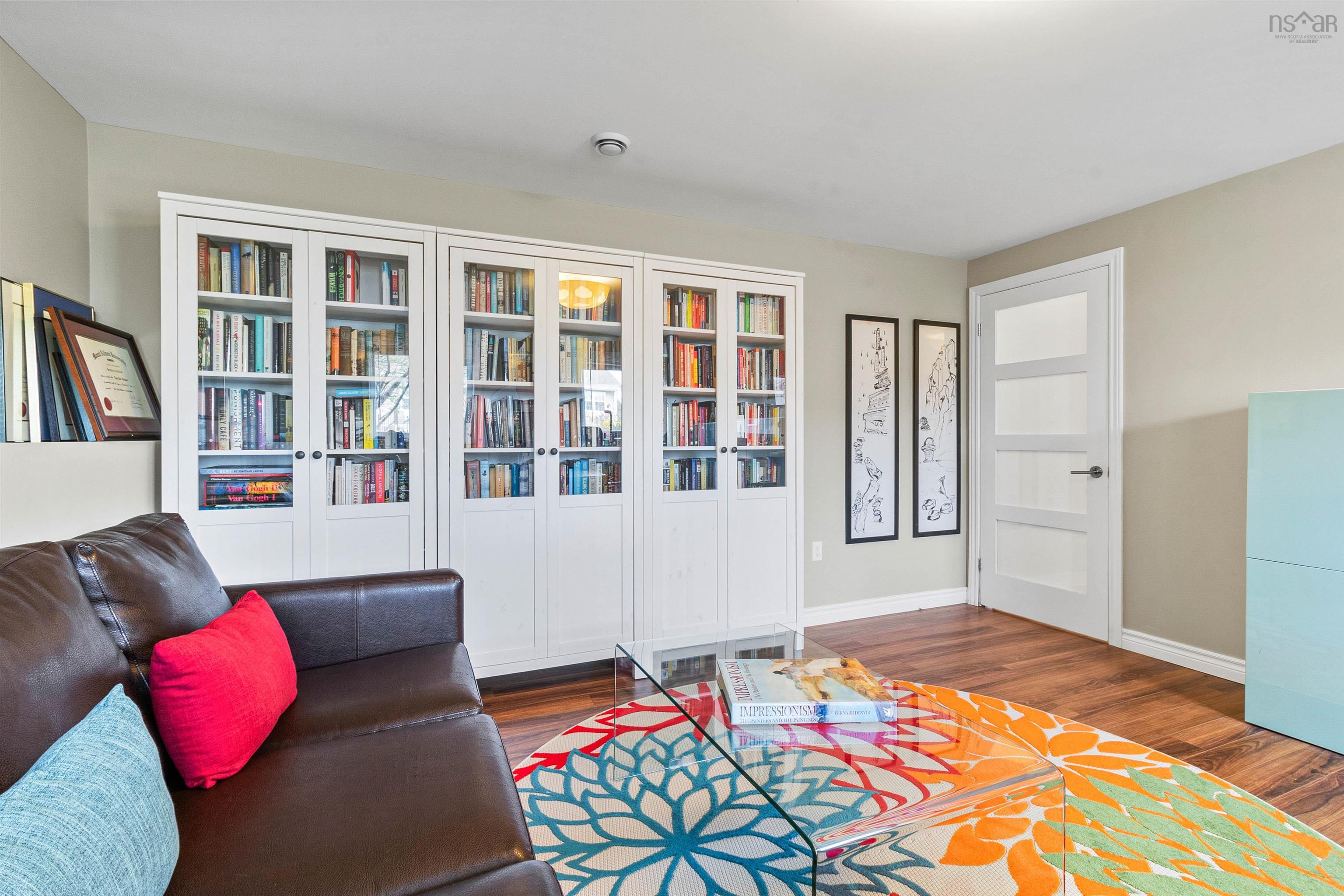 Living area featuring wood finished floors and baseboards