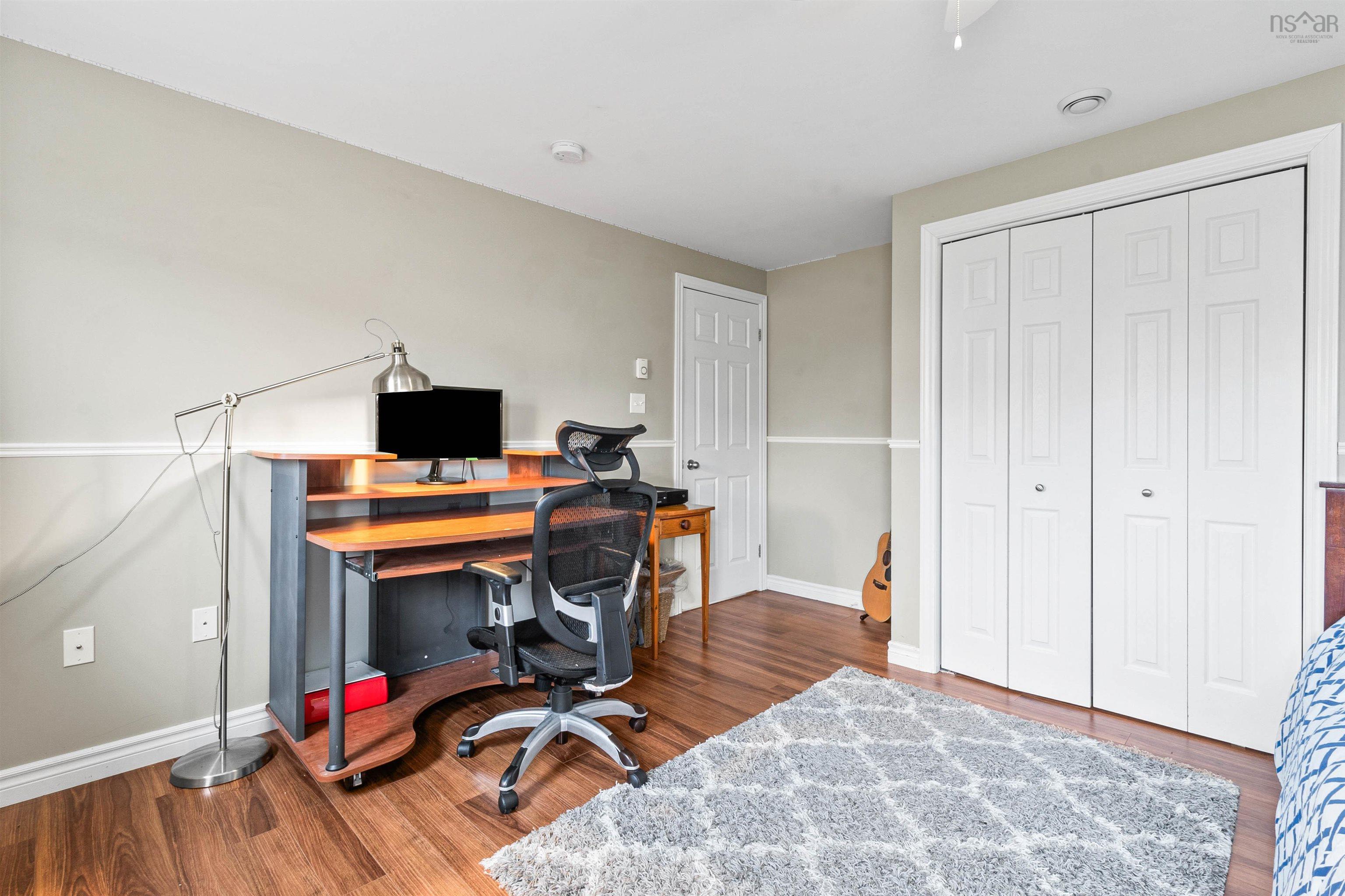 Office space featuring wood finished floors and baseboards