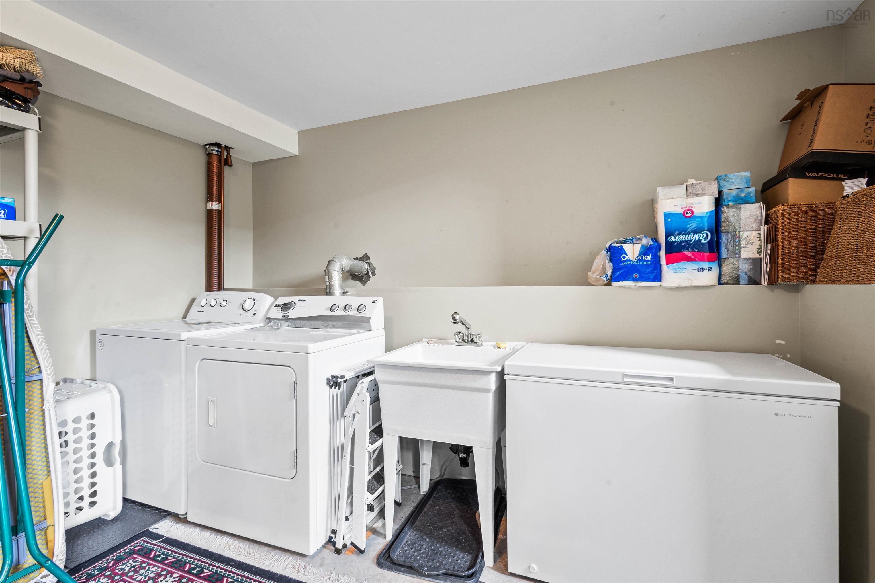 Laundry room with washing machine and dryer