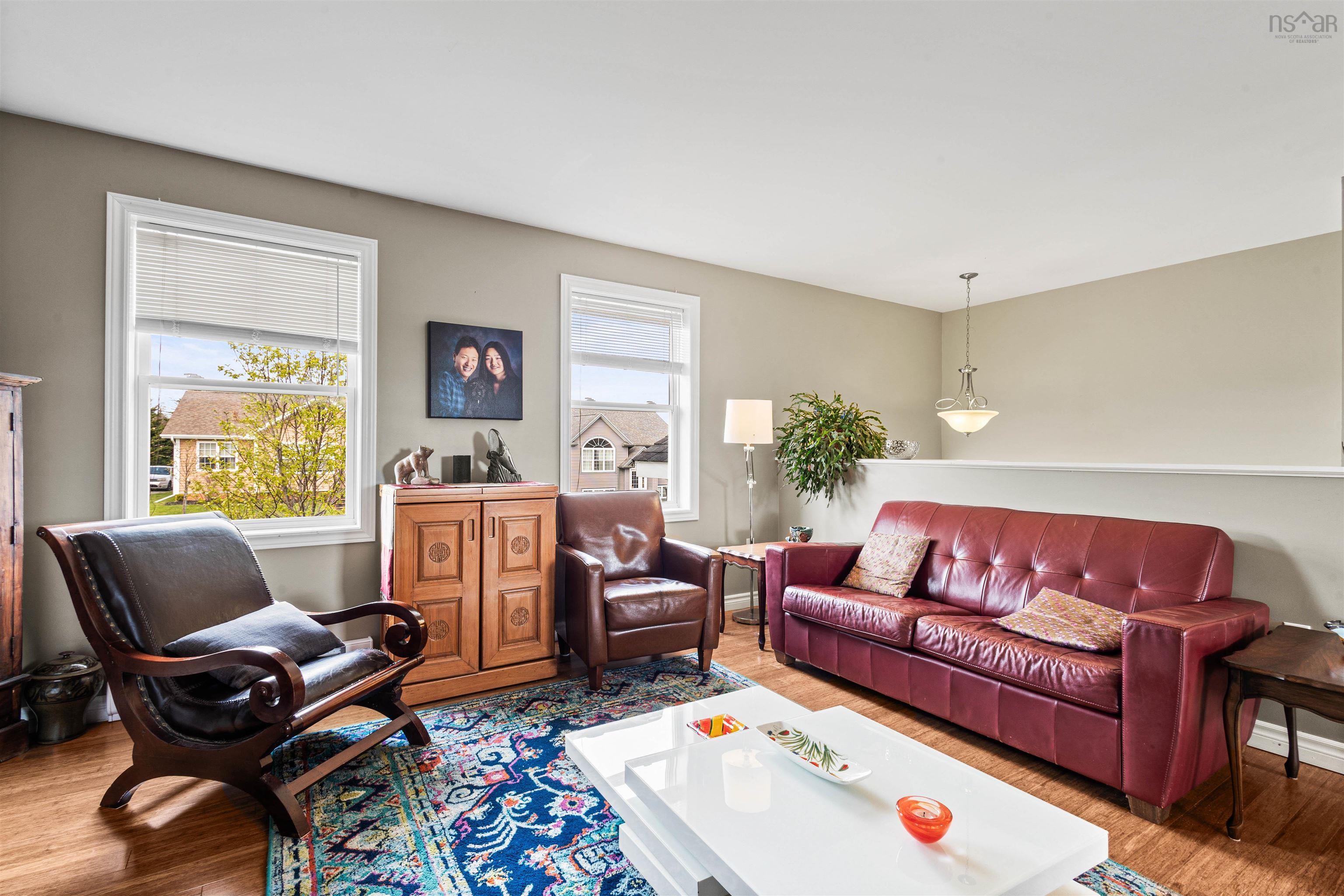 Living room with wood finished floors and baseboards