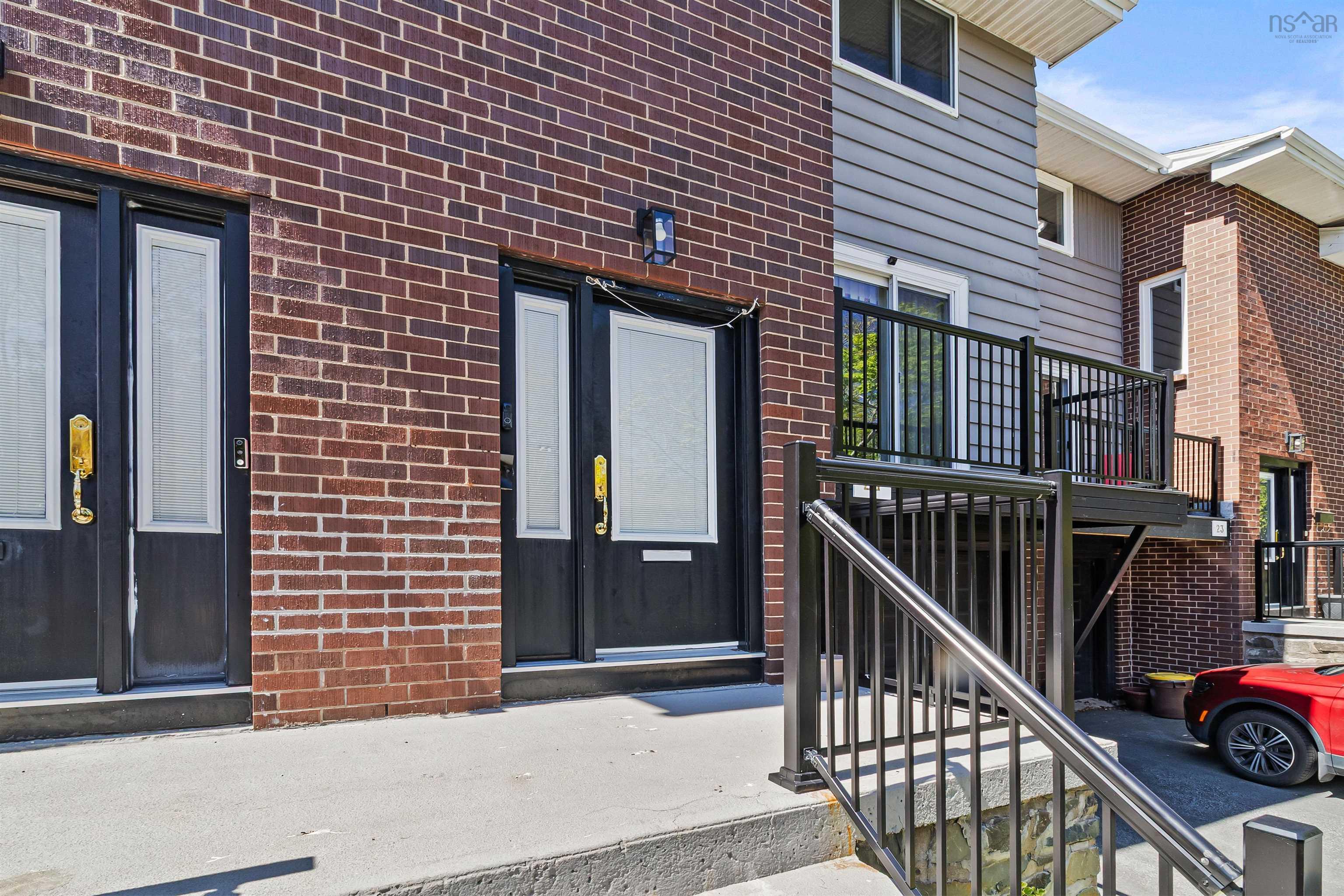 Property entrance with brick siding