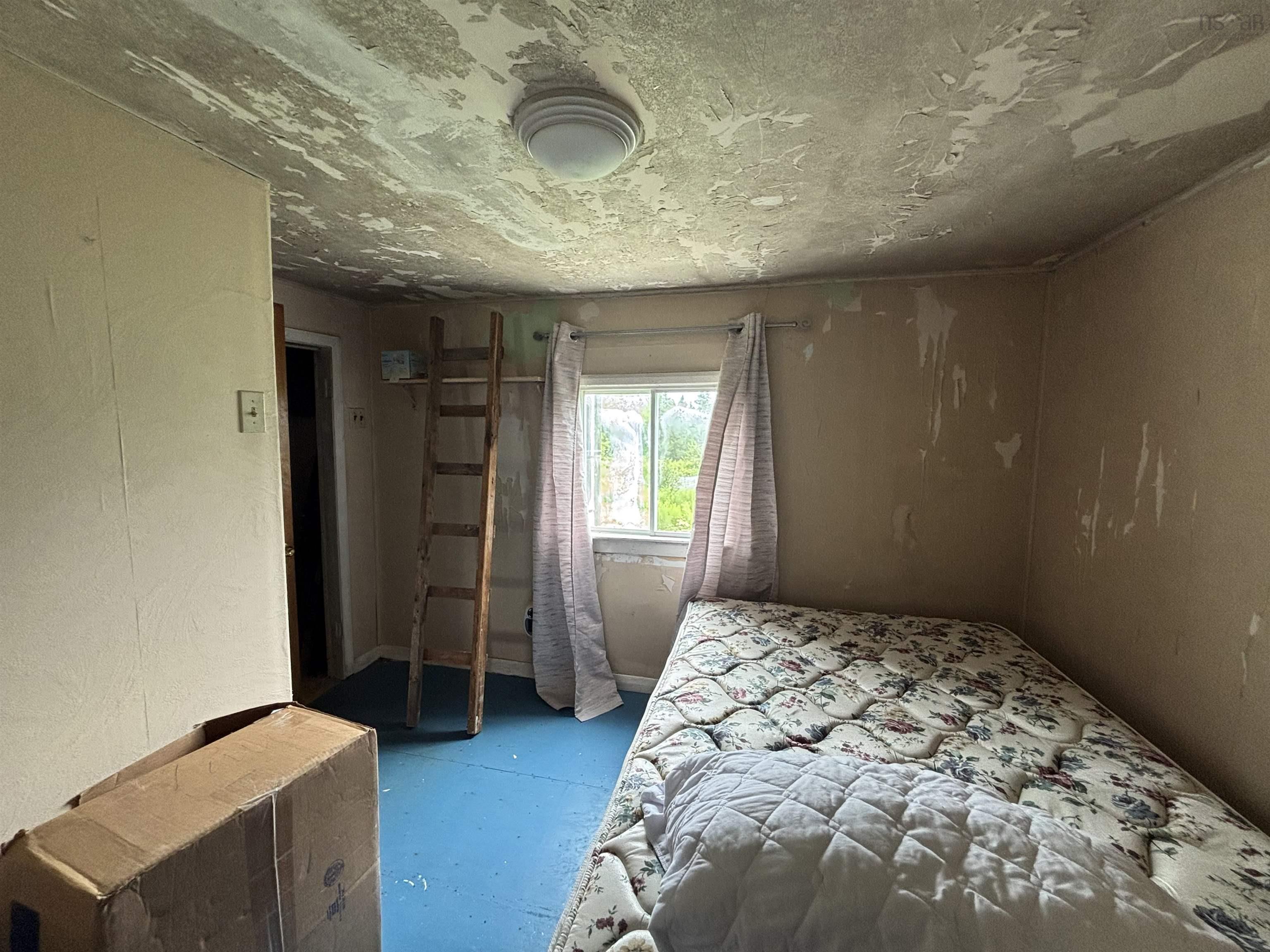 Bedroom with concrete flooring