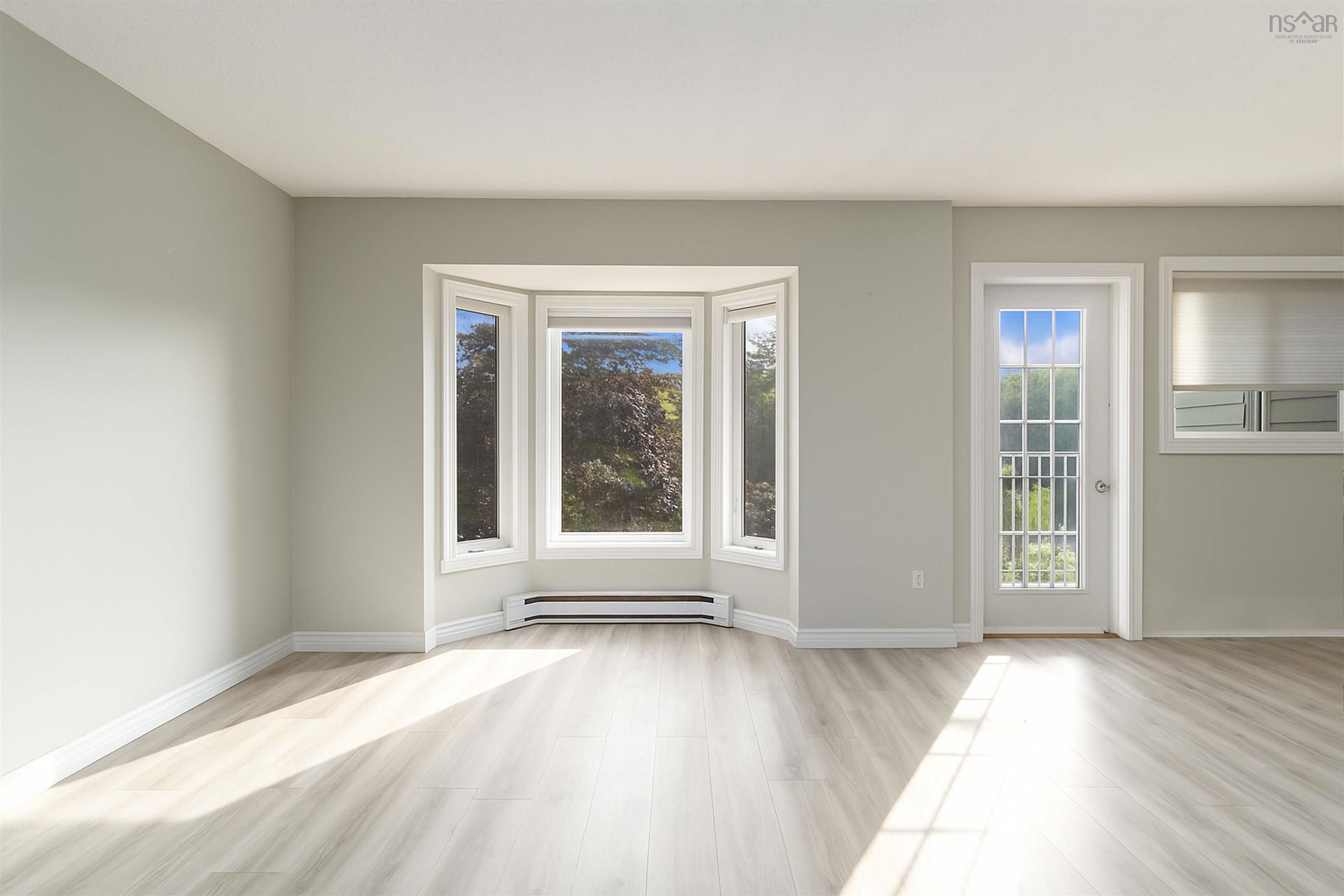 Spare room with light wood-style flooring and baseboard heating