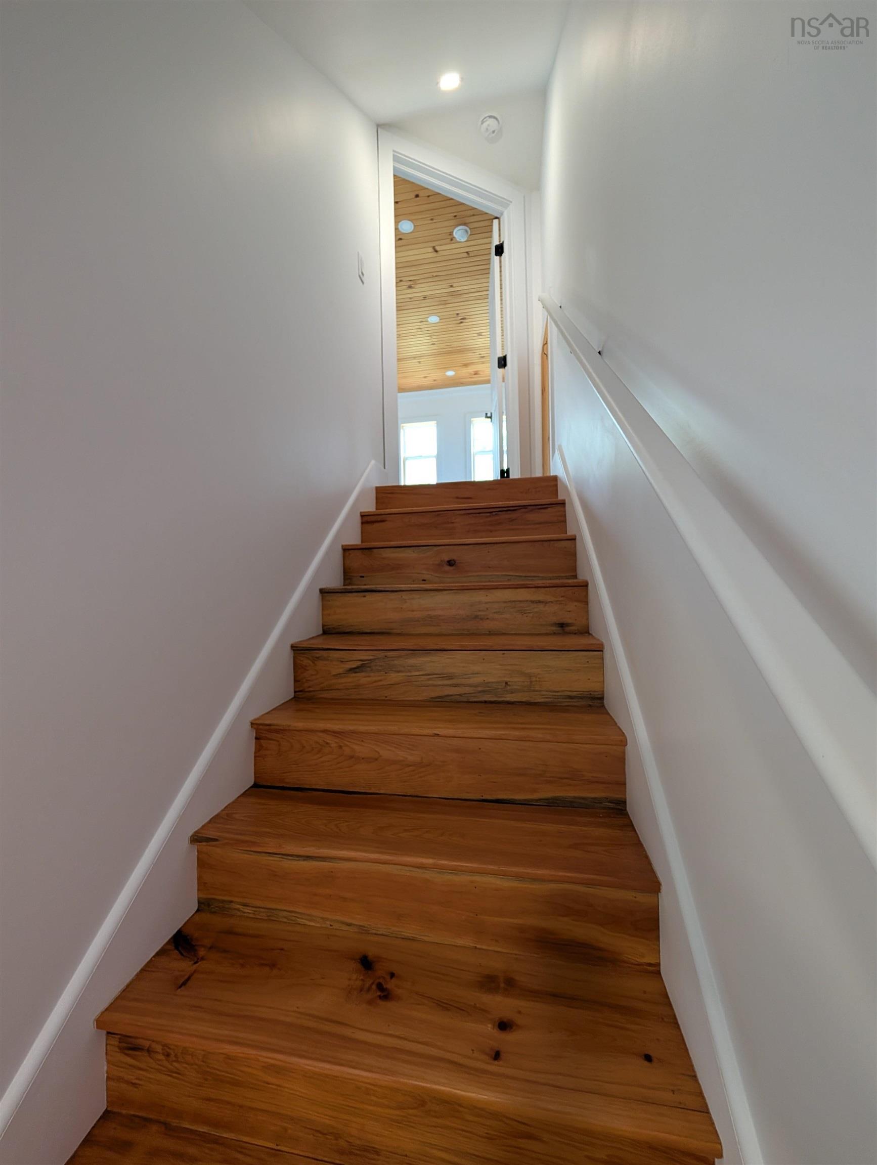 Staircase with wood finished floors