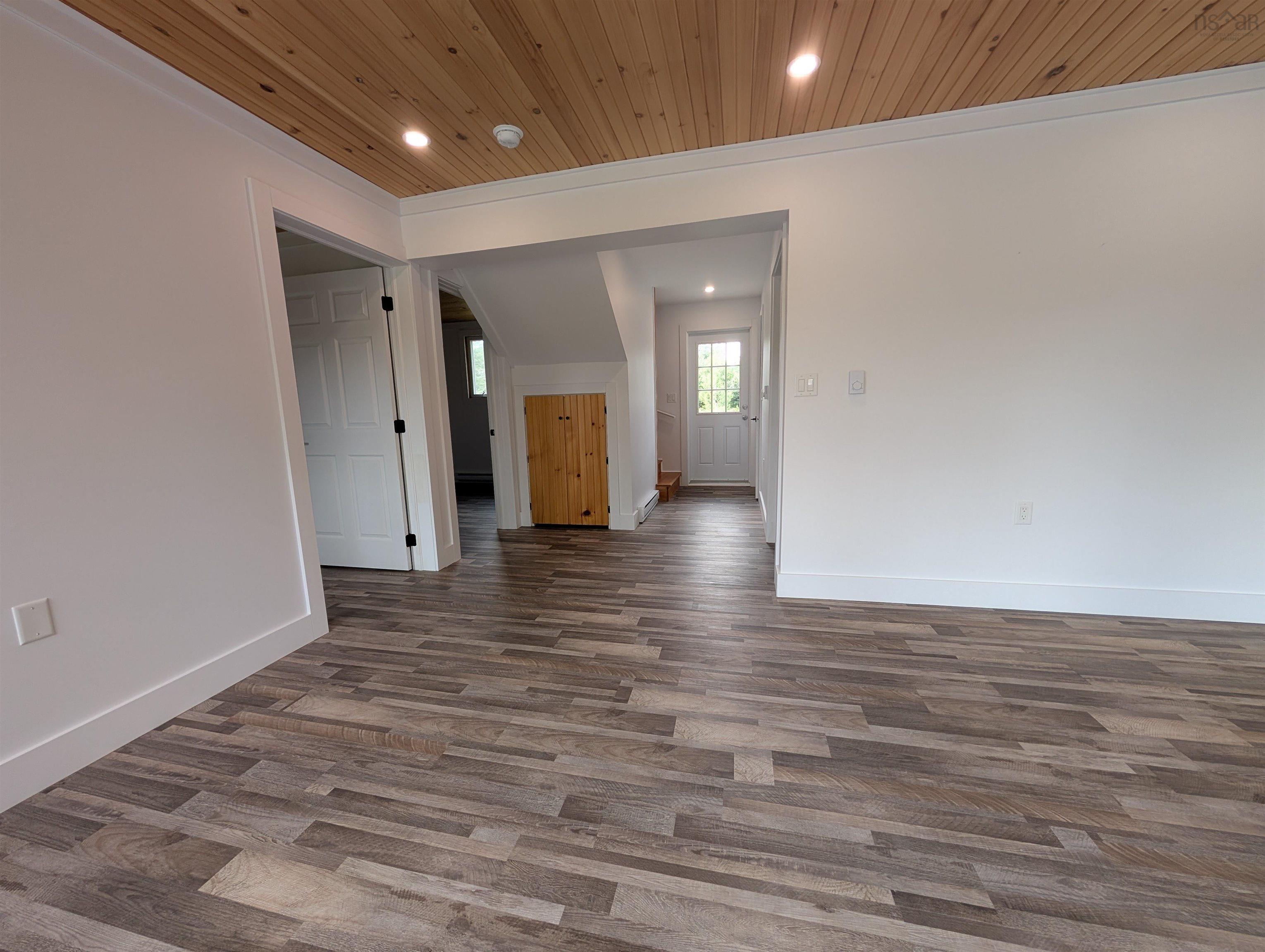 Unfurnished room featuring wood ceiling, dark wood-type flooring, recessed lighting, and crown molding