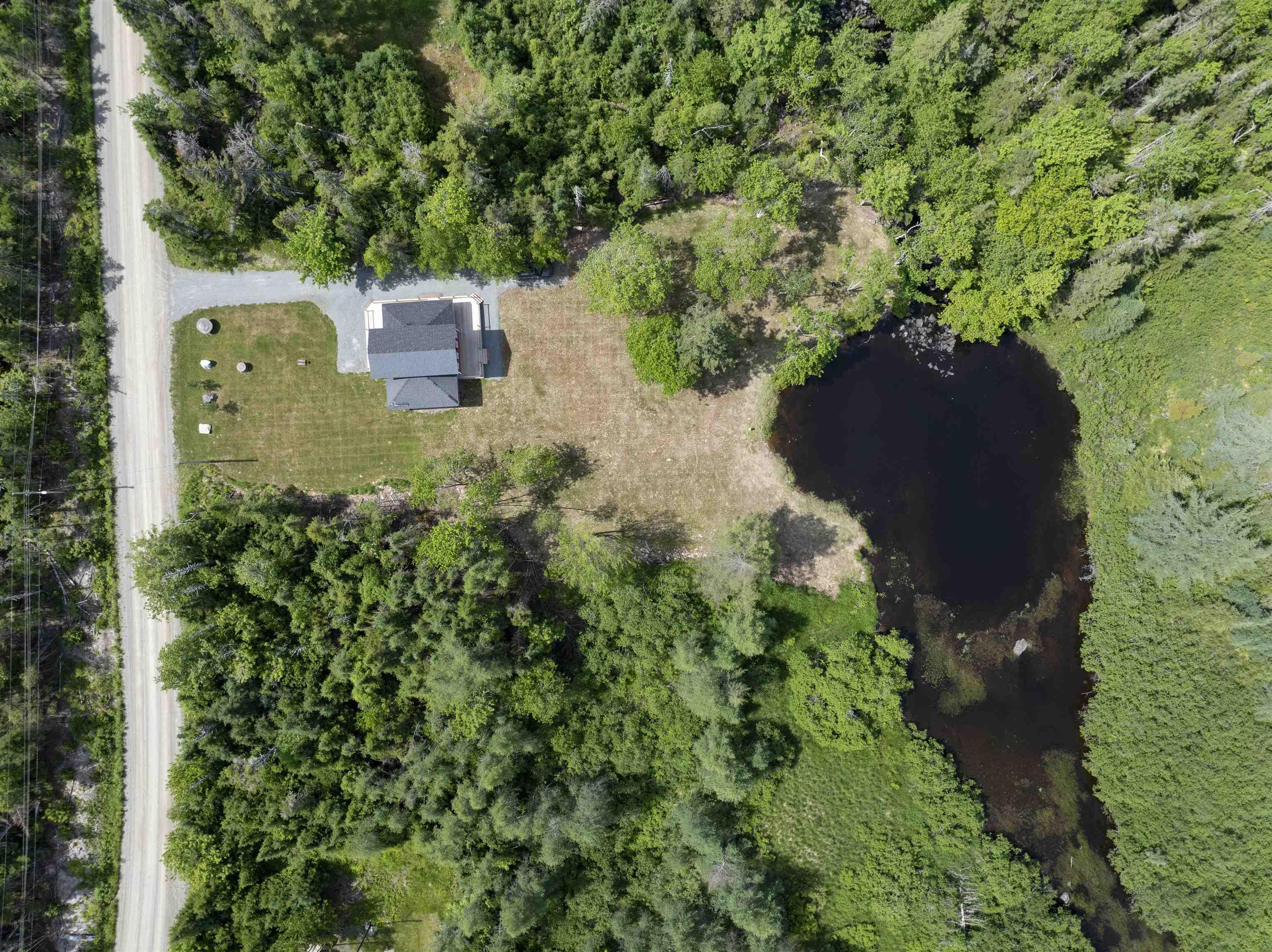 Aerial view of a large body of water and a heavily wooded area