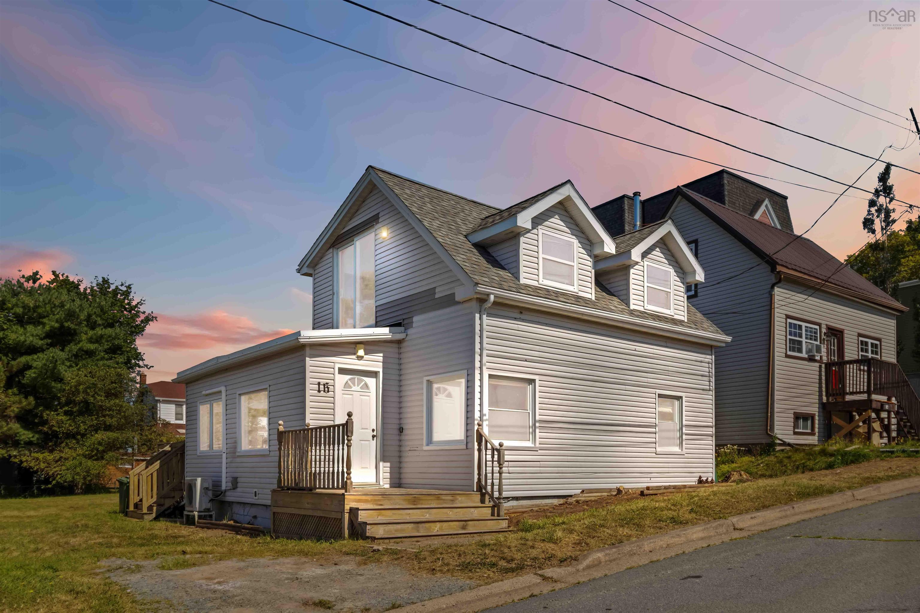 View of front of home featuring roof with shingles