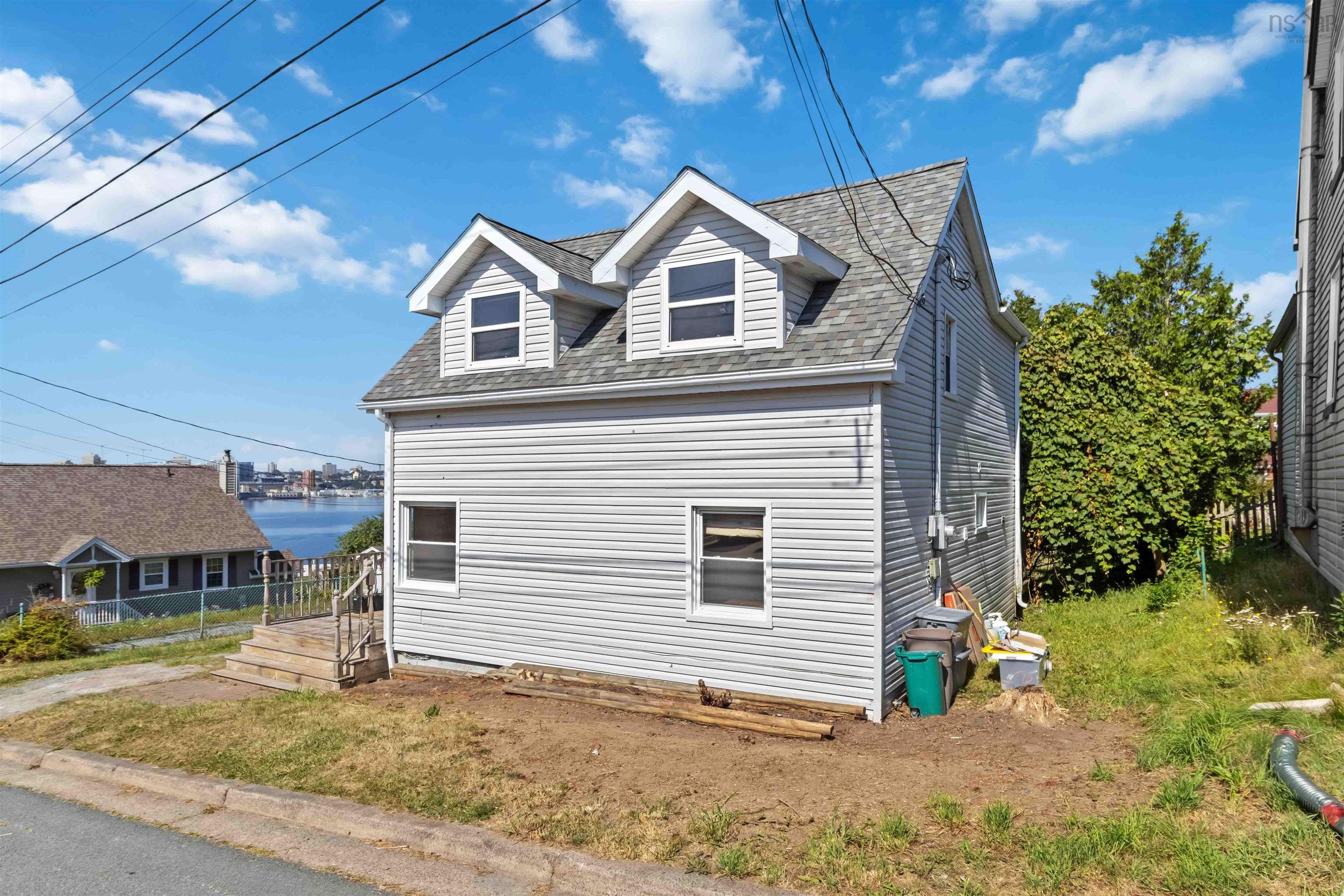 View of home's exterior with roof with shingles