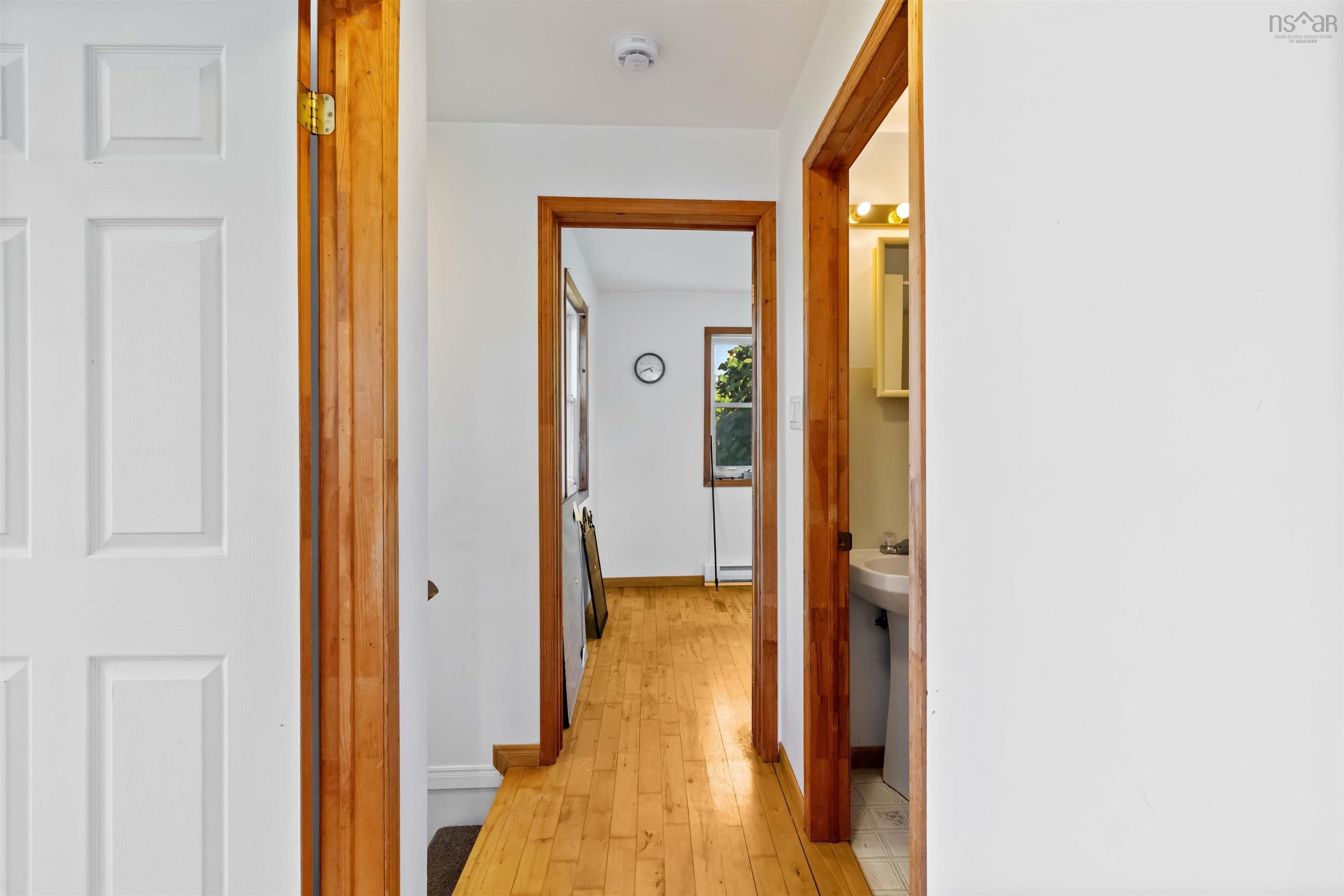 Corridor with light wood-type flooring