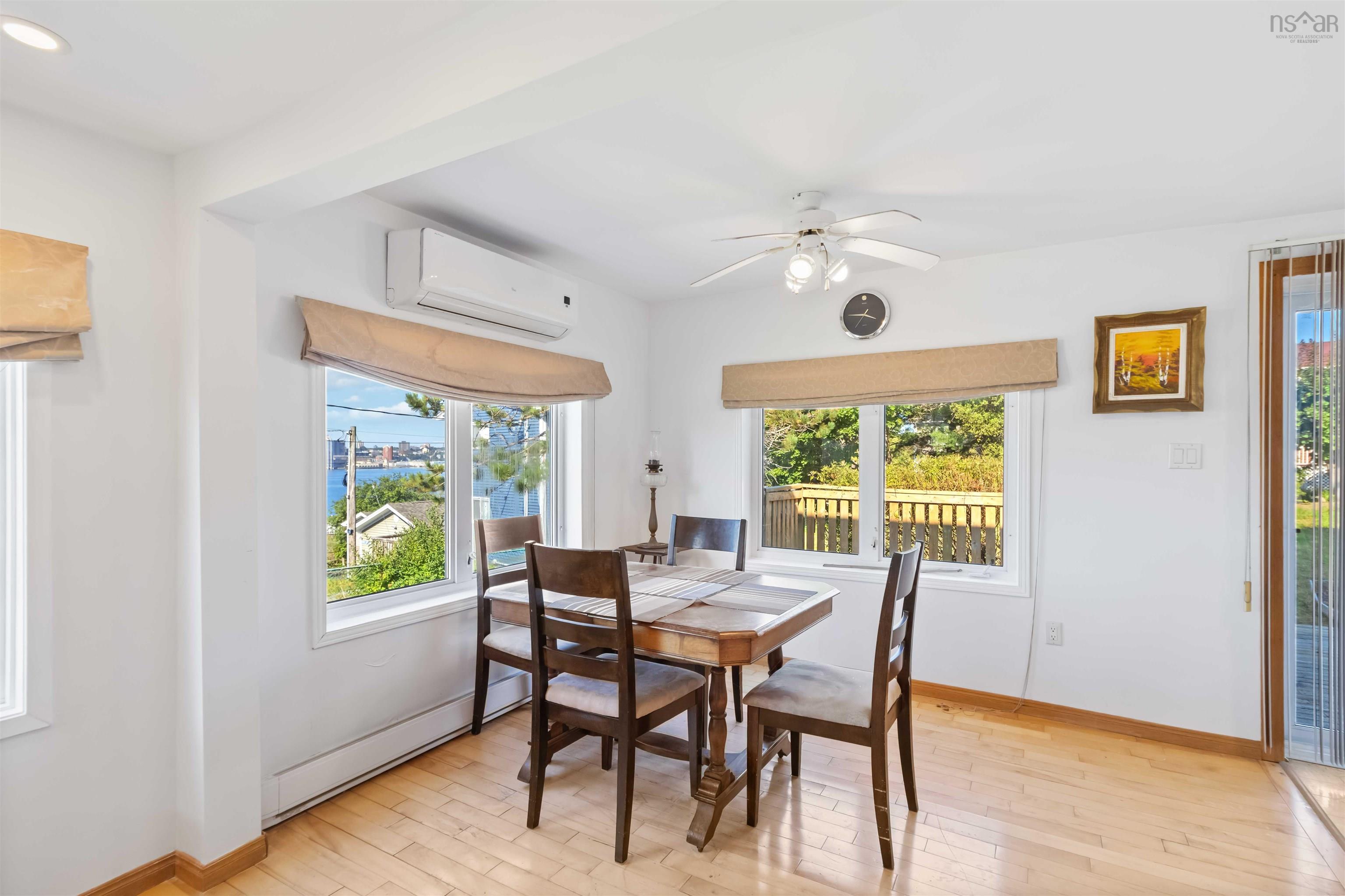 Dining area featuring healthy amount of natural light and a ceiling fan