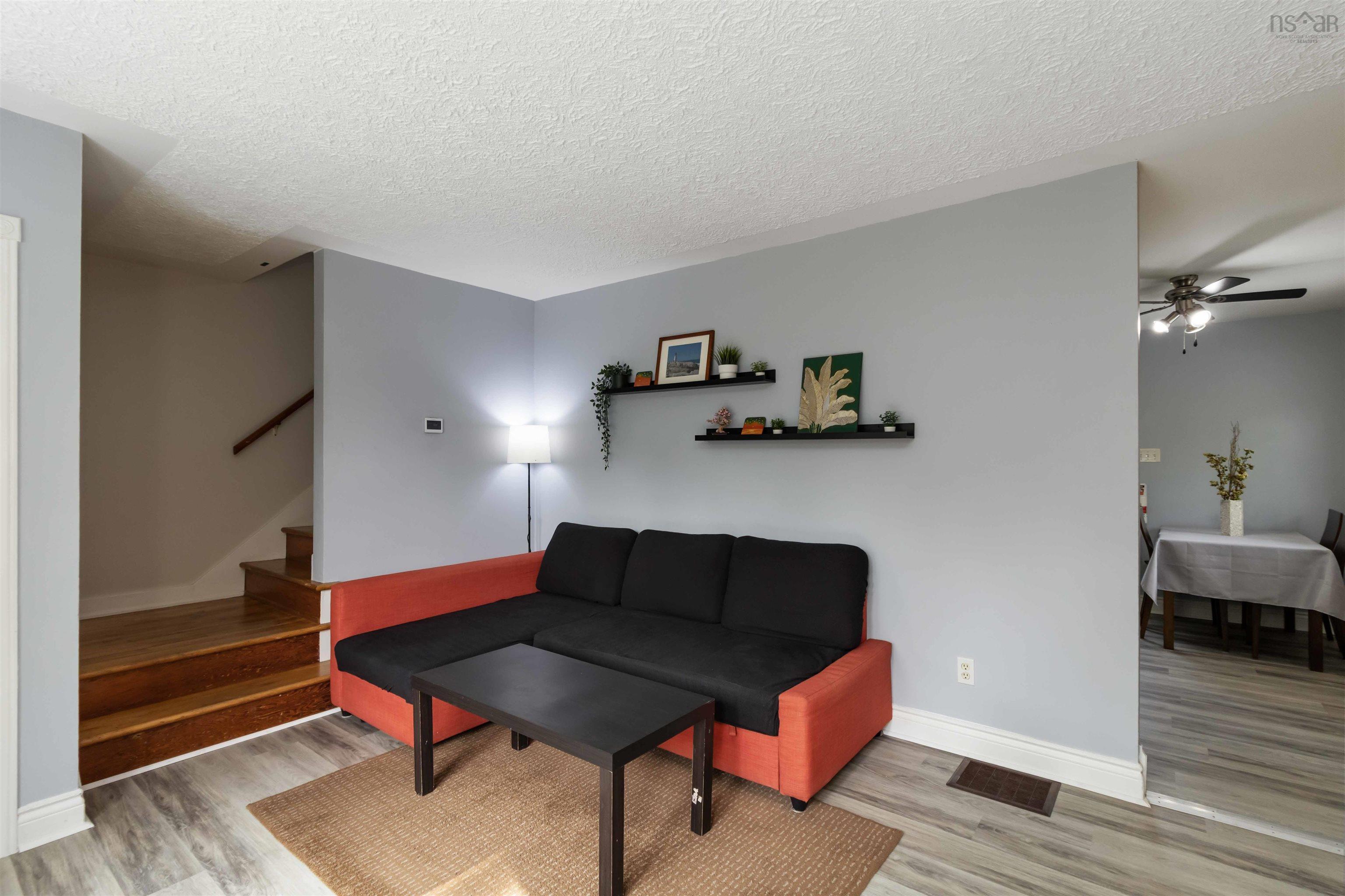 Living room featuring stairway
