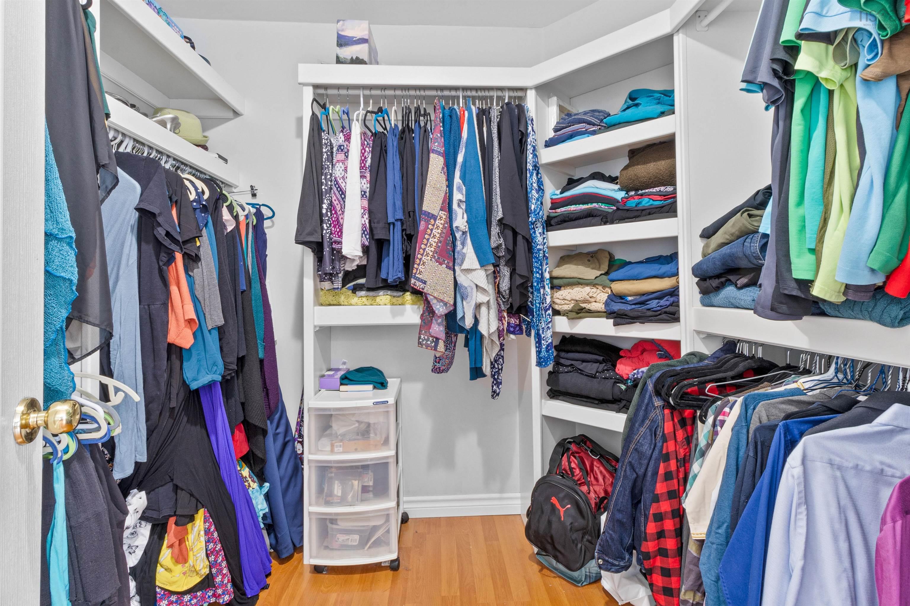 Walk in closet featuring light wood-style flooring