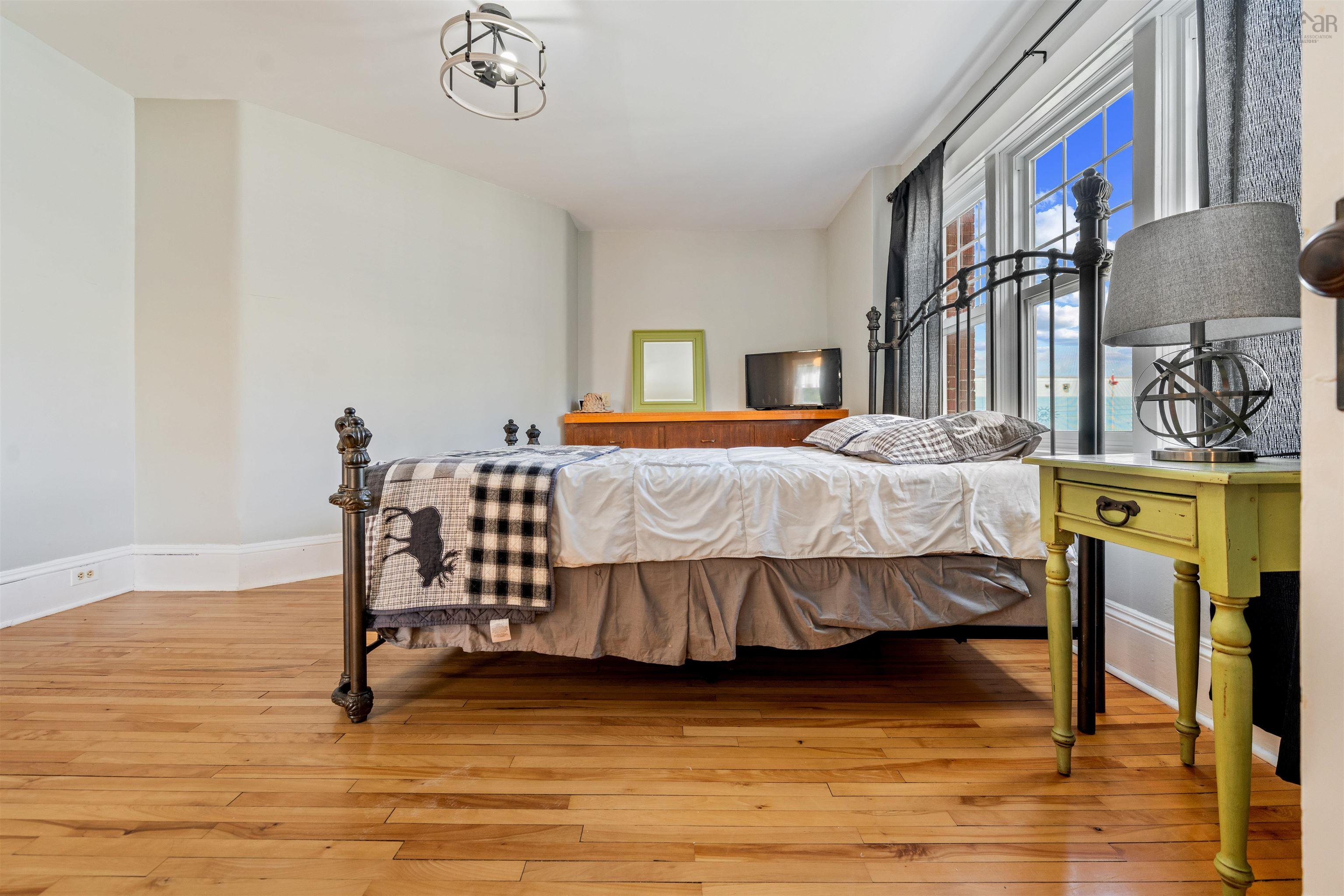 Bedroom featuring baseboards and light wood-style floors