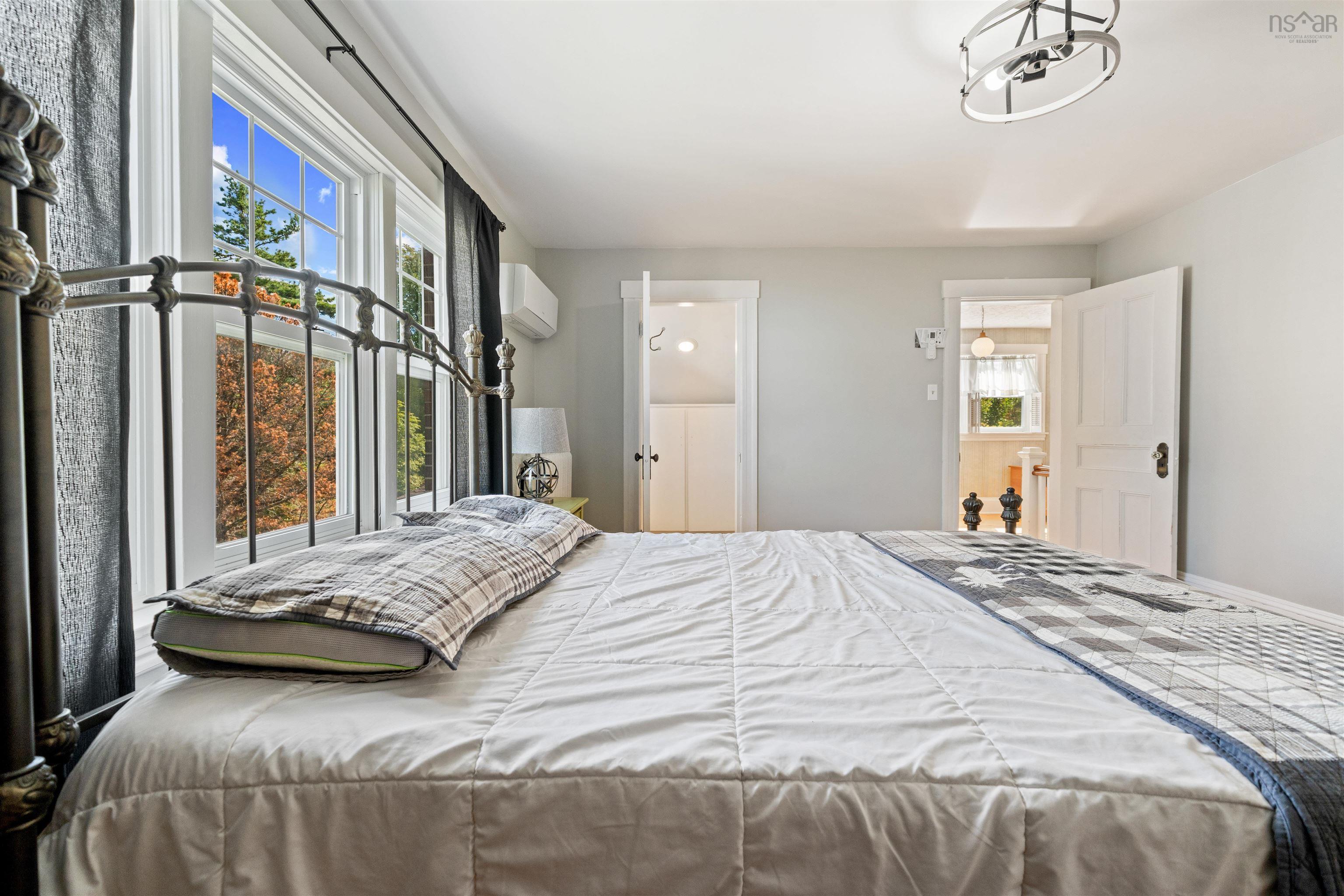 Bedroom featuring a wall mounted air conditioner