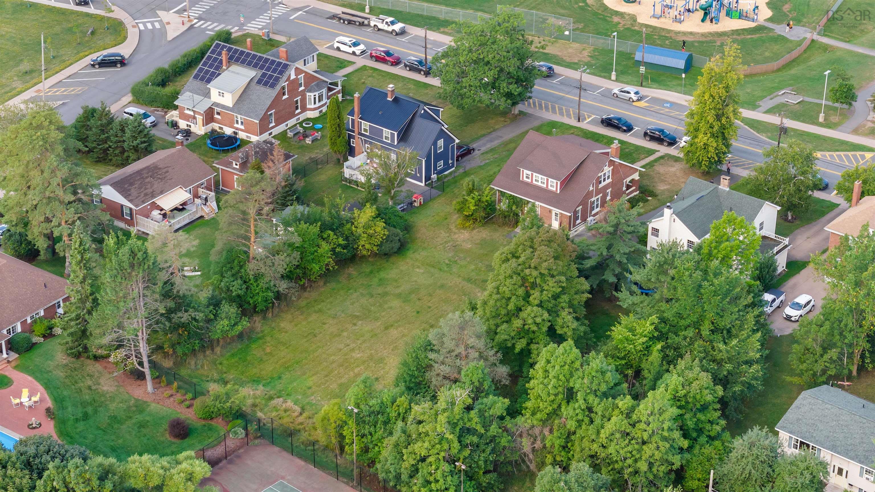 Aerial overview of property's location featuring nearby suburban area