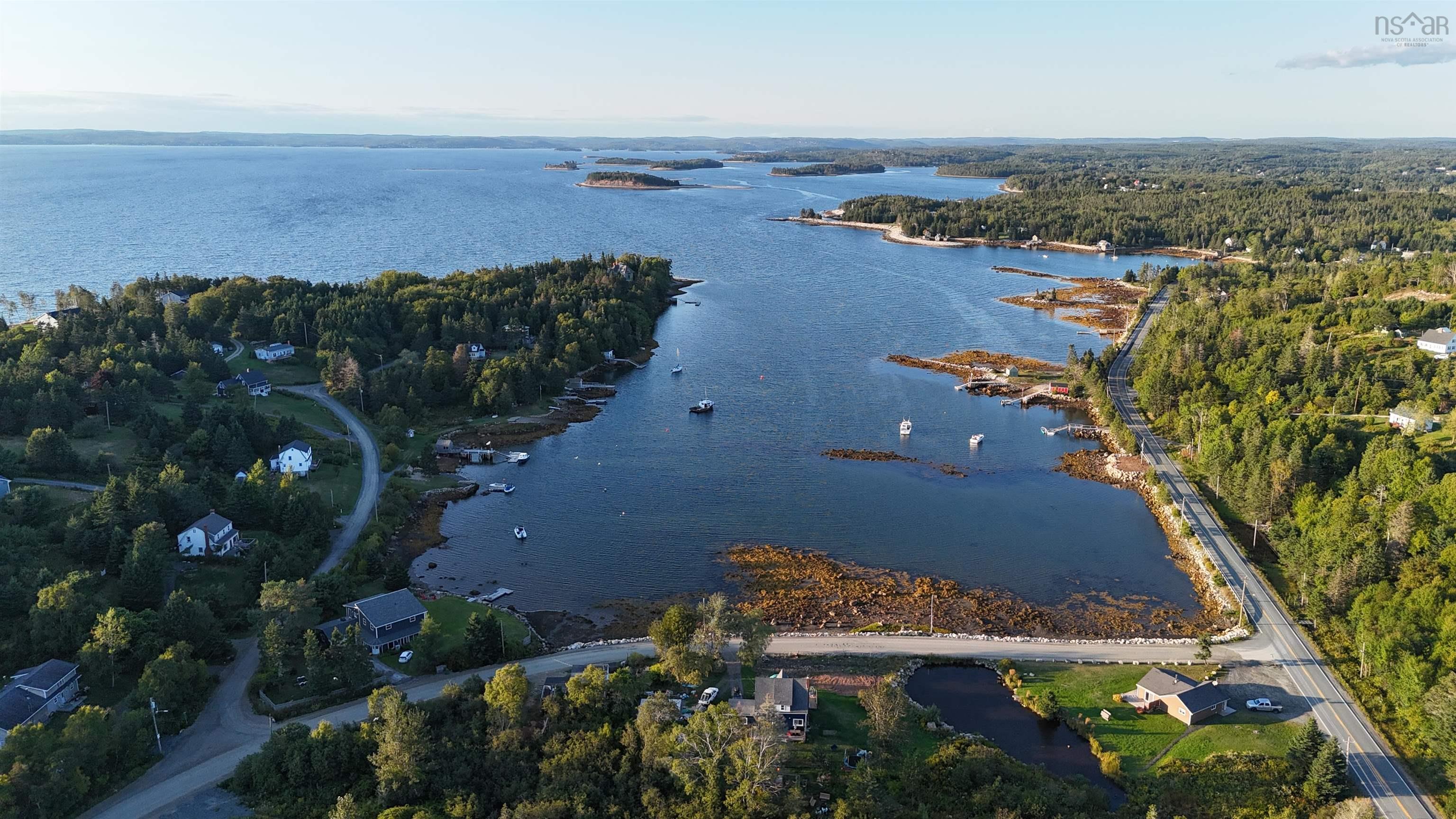 Aerial view of the surrounding area featuring Hackett's Cove.