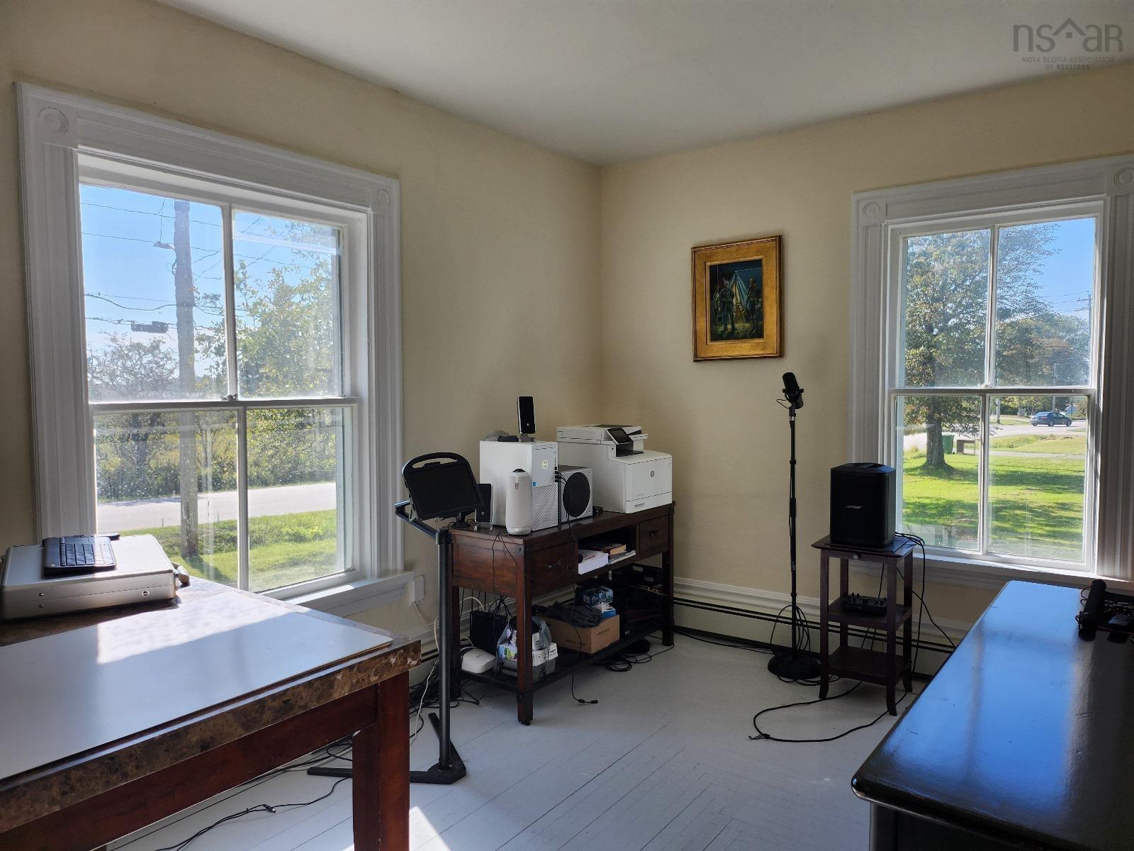 Office area featuring a baseboard heating unit